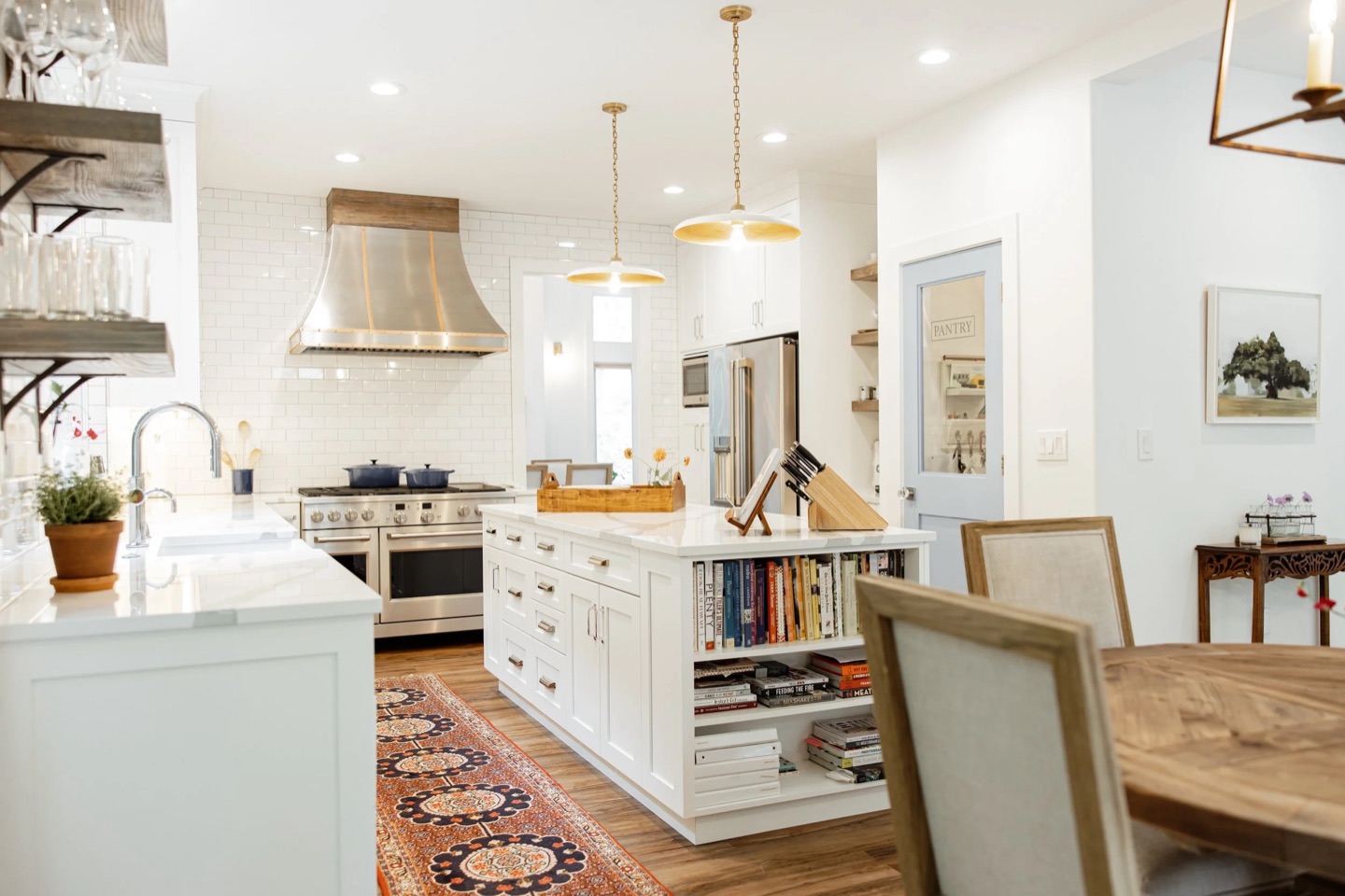 Bothell kitchen remodeled by NW Build with brass pendants and open shelving.